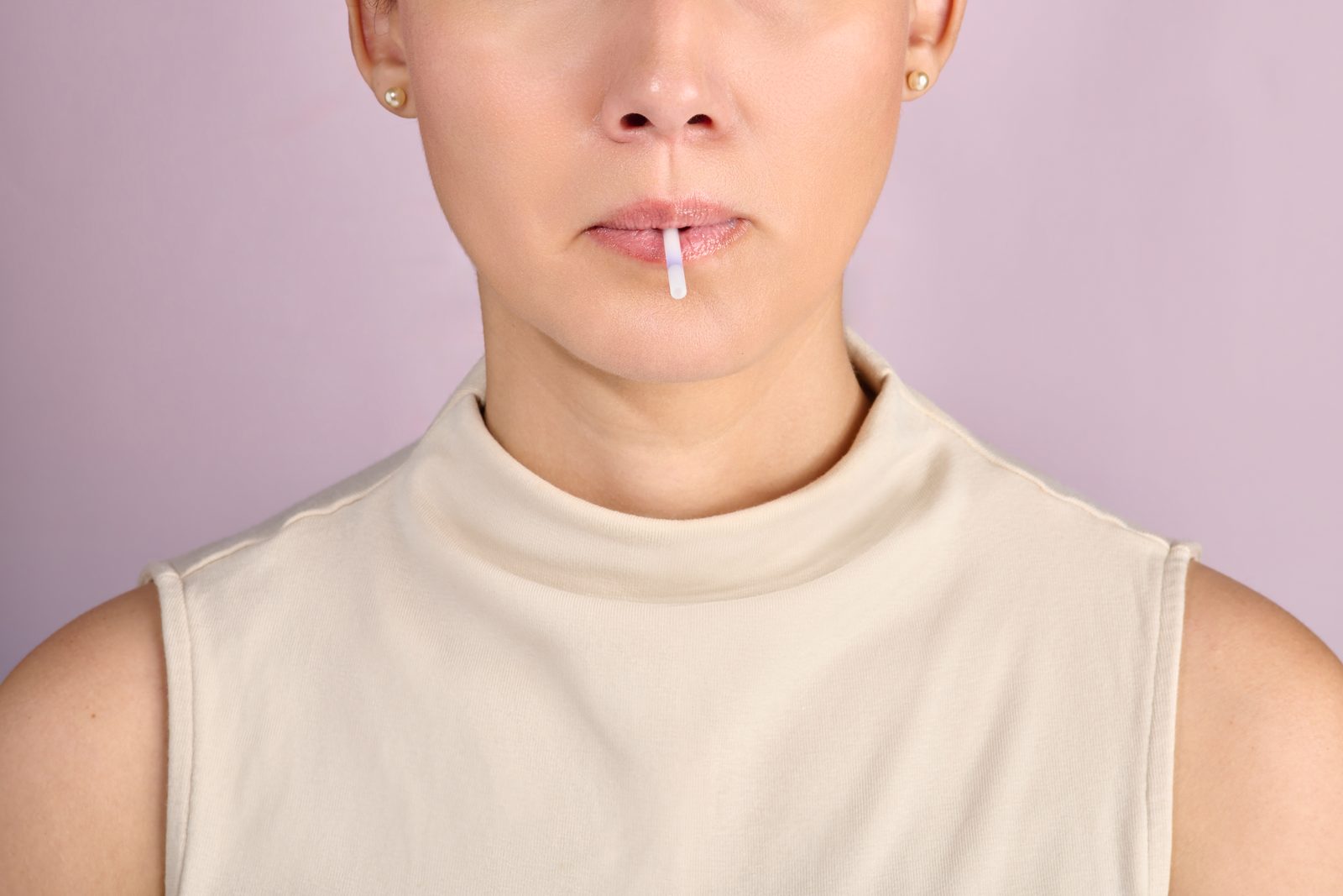 Woman taking a Hormony saliva sample with the collection swab