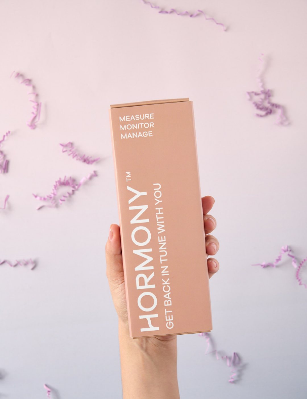 A hand holding the Hormony® Cortisol Rhythm test kit box